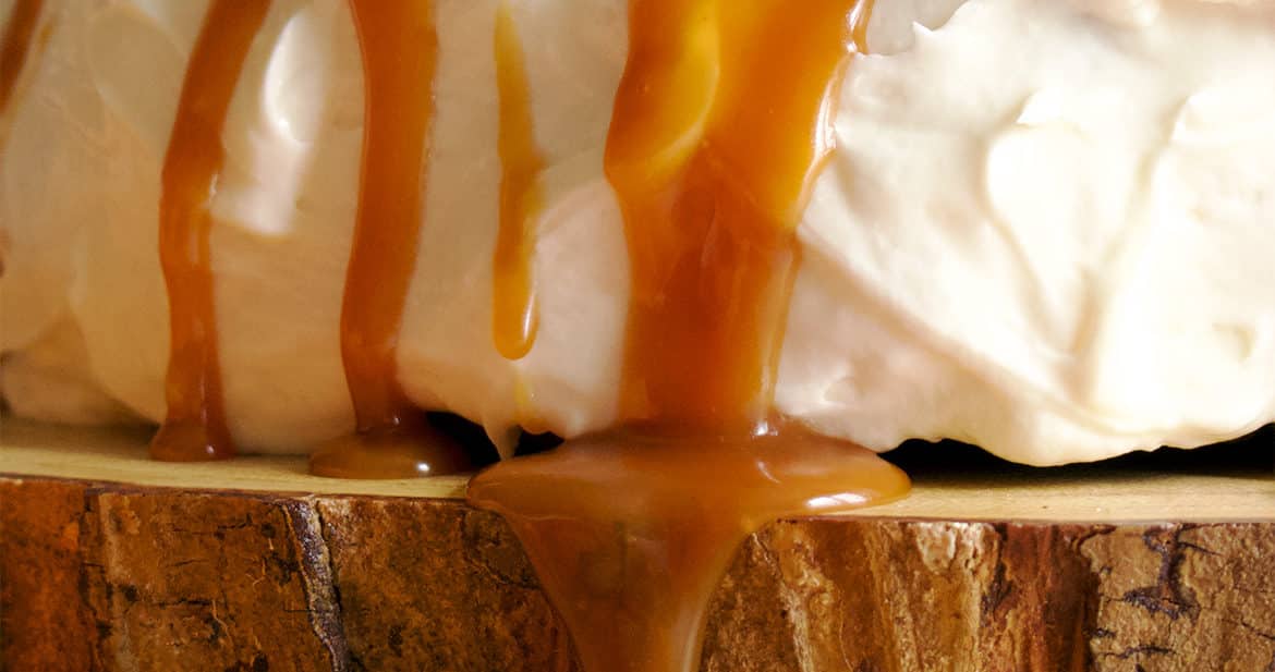 Salted Caramel Rum Sauce Dripping Down the Side of a cake.