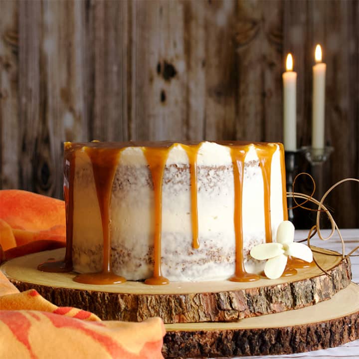 Carrot Cake Layer Cake with Cream Cheese Buttercream and Salted Caramel Rum Sauce.