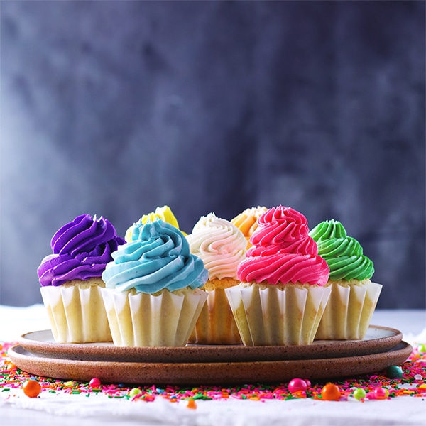 Cupcakes frosted with colorful Italian Meringue Buttercream