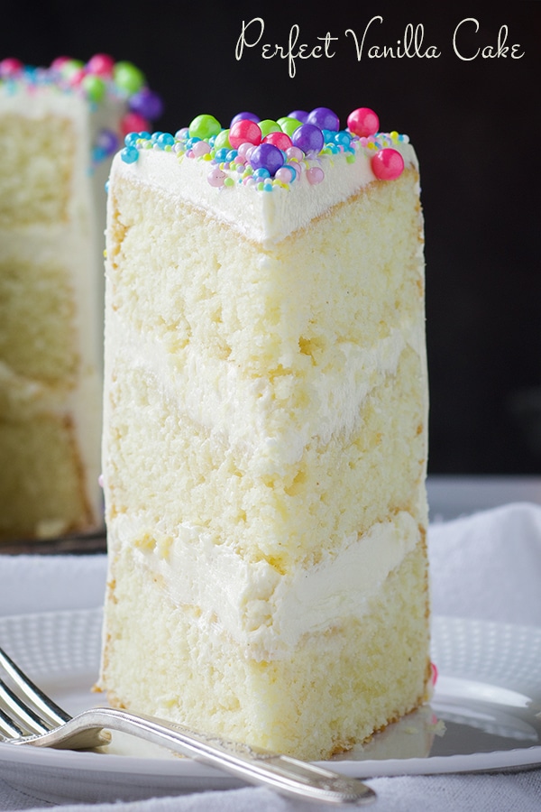 A slice of 3-layer perfect vanilla cake with vanilla Italian Meringue Buttercream