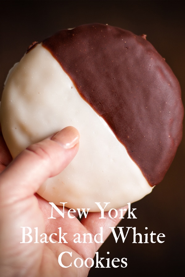 Holding a New York Black and White Cookie.