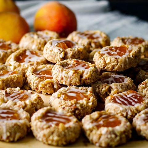 A tray of peach almond thumbprint cookies.