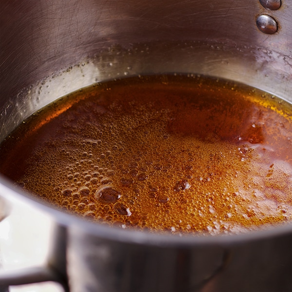 Cooking the sugar for salted caramel sauce.