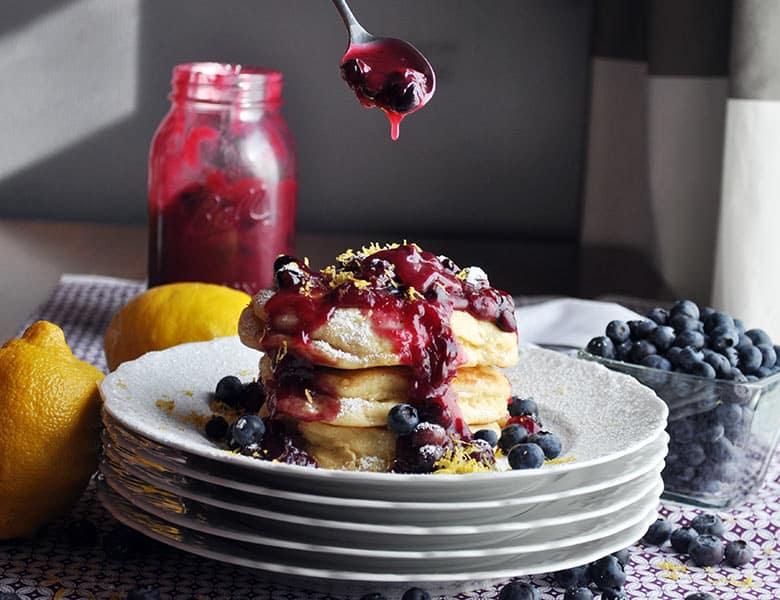 Lemon ricotta pancakes with blueberry sauce | ofbatteranddough.com