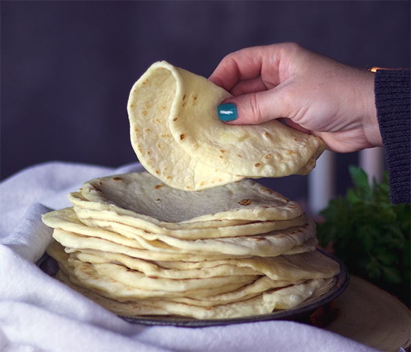 A stack of soft, easy homemade tortillas {al butter recipe}
