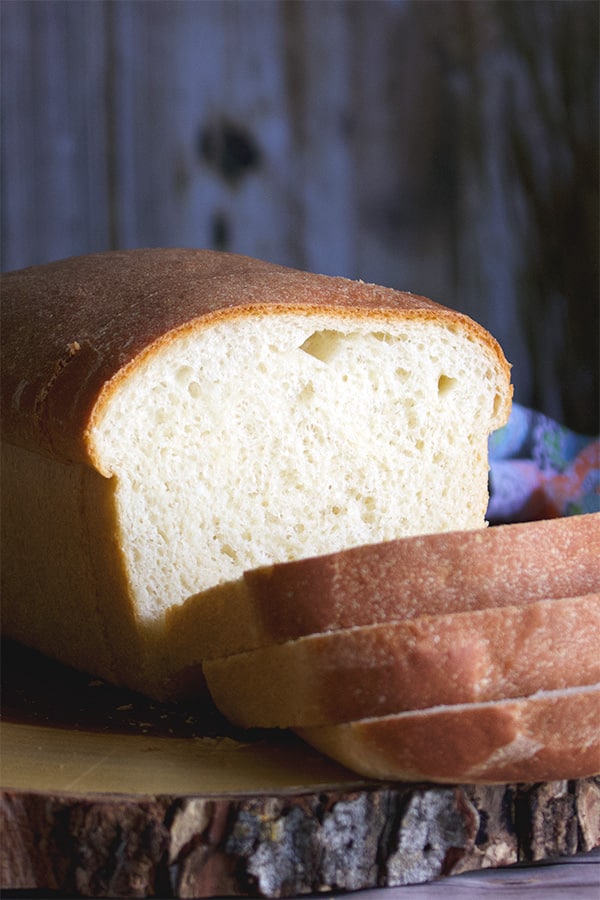 A sliced loaf of perfect simple homemade sandwich bread.