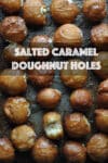 Salted caramel custard filled doughnut holes on a baking sheet.