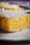 Lemon bars on a serving platter, sprinkled with powdered sugar.