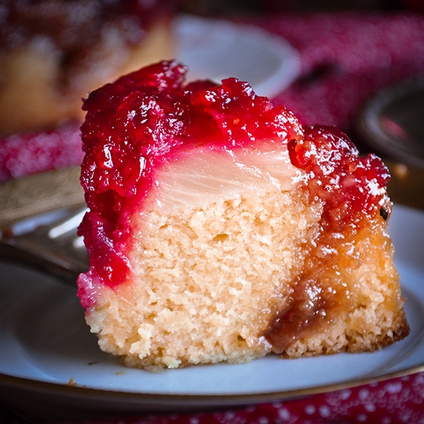 A slice of A cranberry pineapple upside down cake.