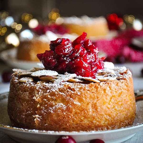A Almond Cake topped with Cranberry Sauce.