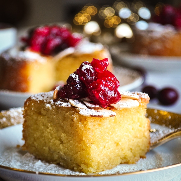 A slice of Almond Cake with Cranberry Sauce.