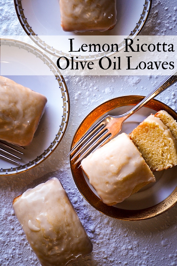 Several Lemon Ricotta Olive Oil Loaves on plates, ready to serve.