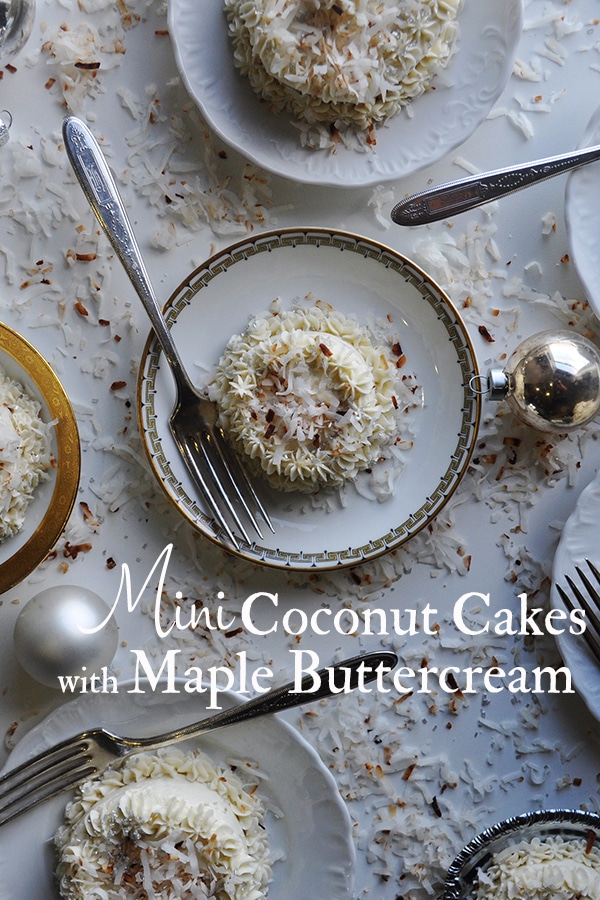 Several plates of mini coconut cakes with maple Italian meringue buttercream.