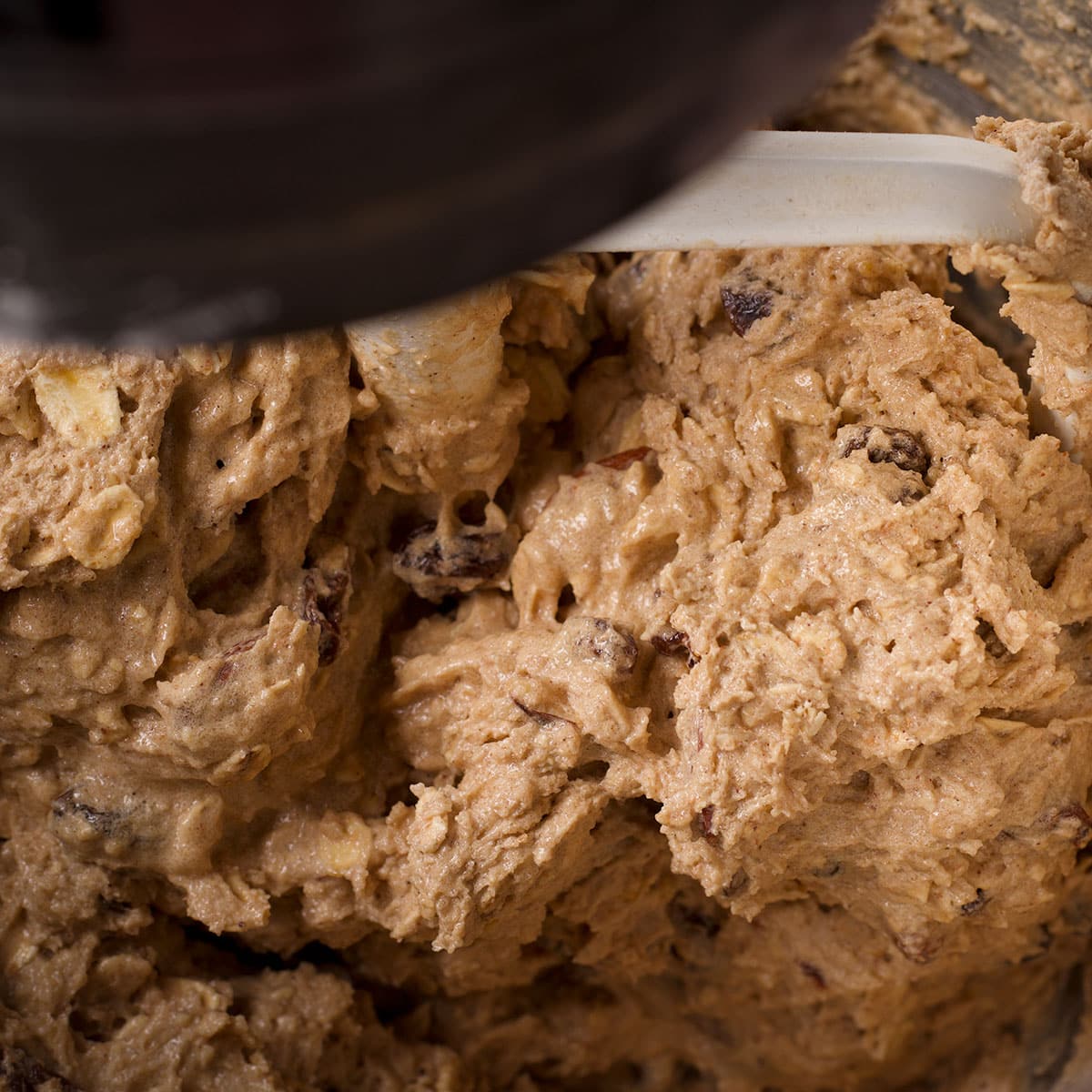 Mix the almonds, eggs, and raisins into the cookie dough. 