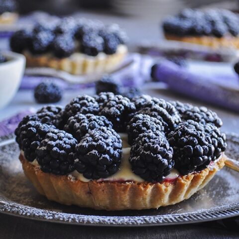 Blackberry custard fruit tarts with amaretto.
