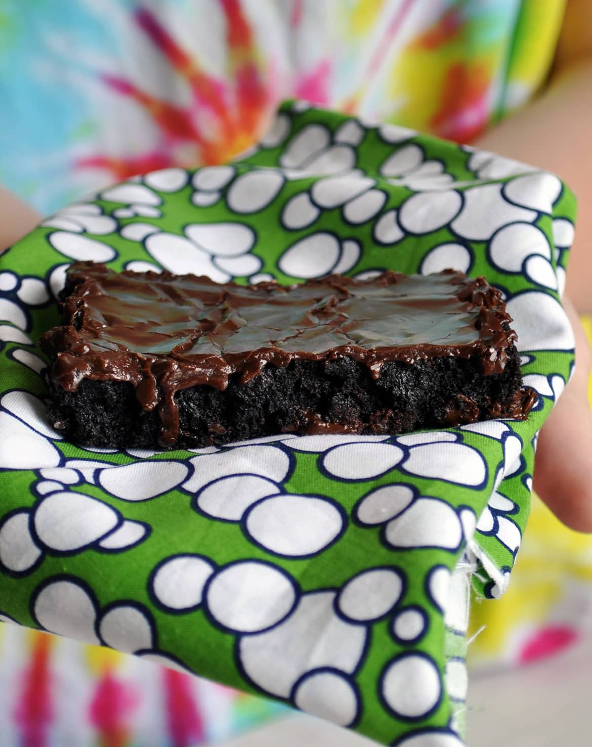 Holding a frosted brownie | Sheet Pan Frosted Brownies for a Crowd