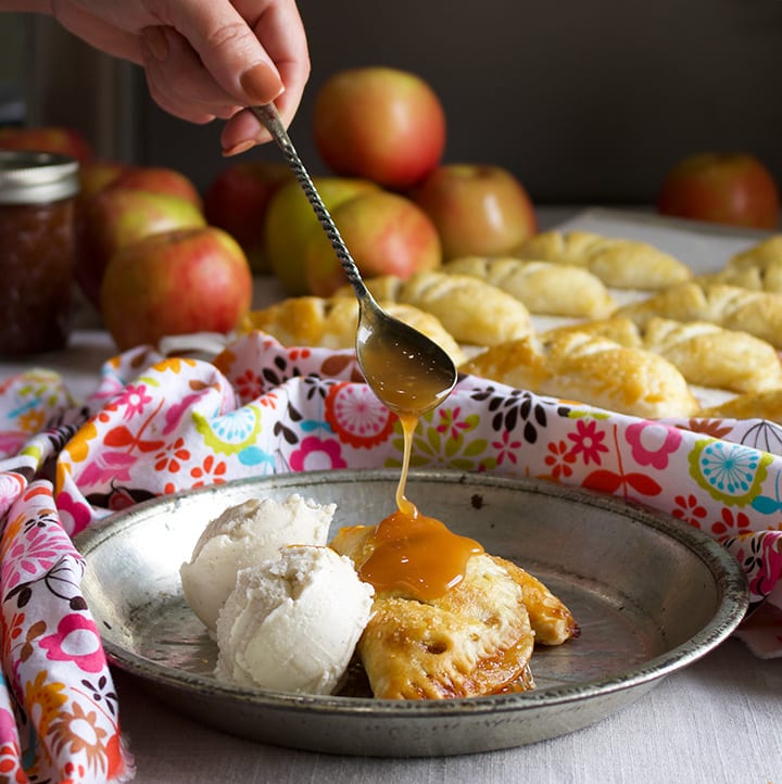 Drizzling caramel sauce over Apple Butter and Cream Hand Pies