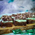 A tray of Chocolate Mint Brownies, cut into slices and ready to eat.
