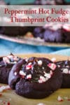 A plate filled with peppermint hot fudge thumbprint cookies.