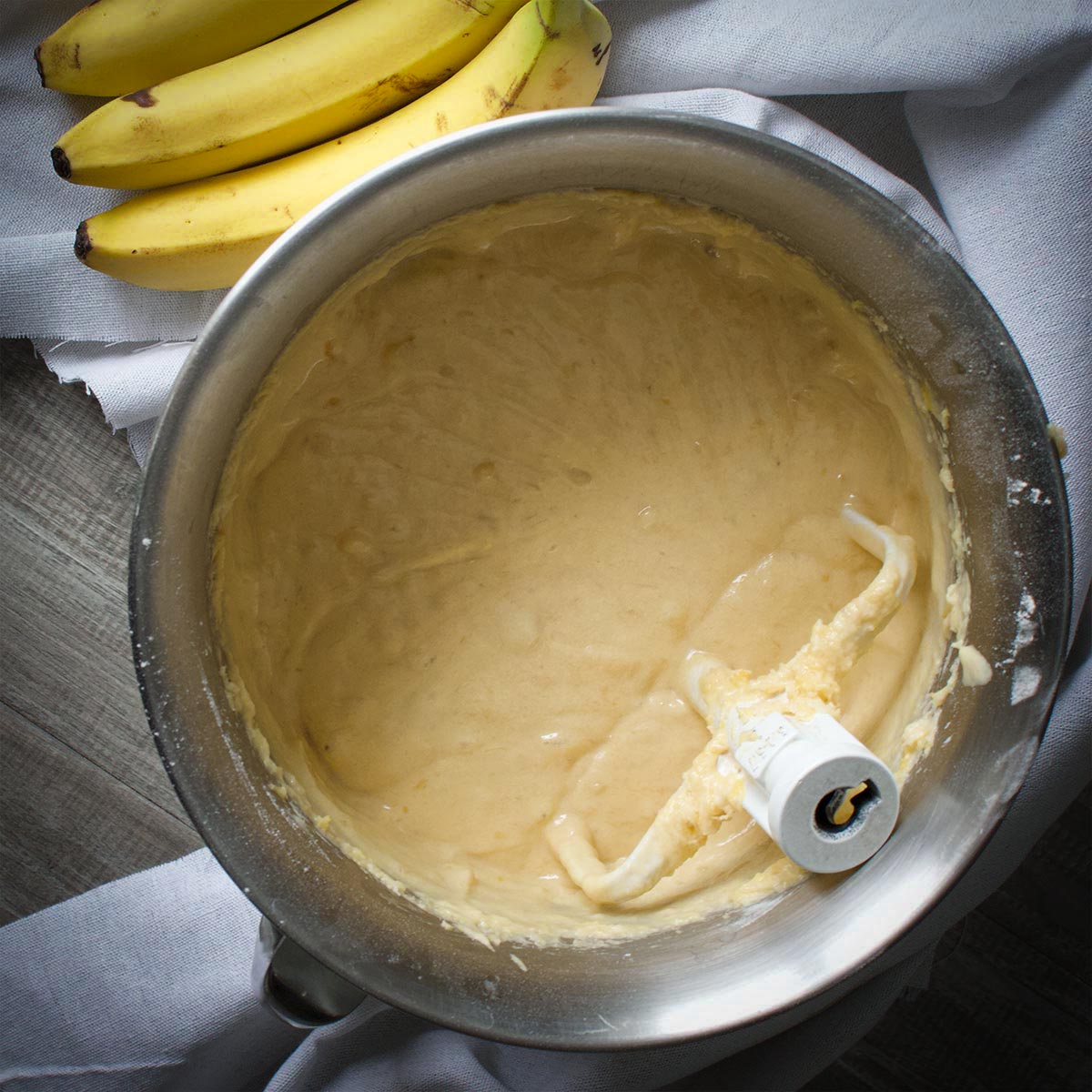 A mixing bowl filled with banana bread batter.