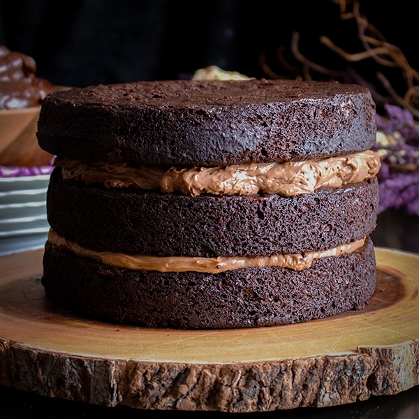 Stacking the layers for three-layer chocolate blackout cake.