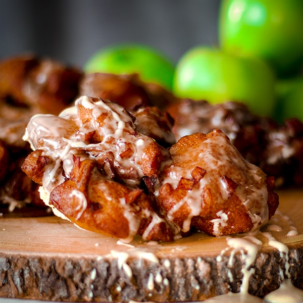 A homemade apple fritter with maple glaze.