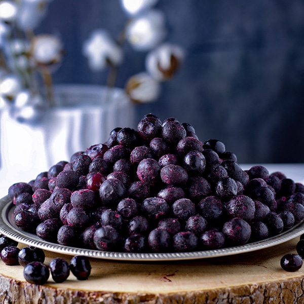 A plate of frozen blueberries