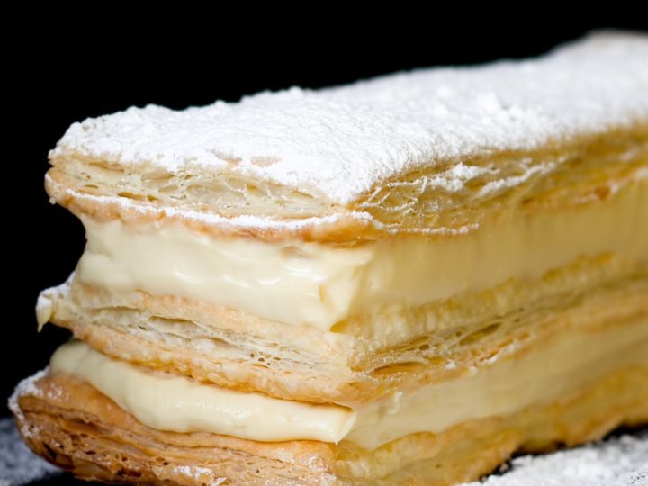 Profiteroles, cream puff, traditional French dessert on white plate Stock  Photo - Alamy