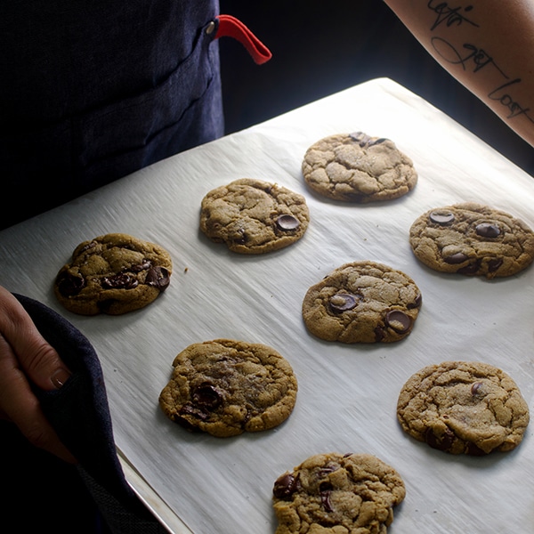 A tray of freshly baked soft chocolate chip cookies.