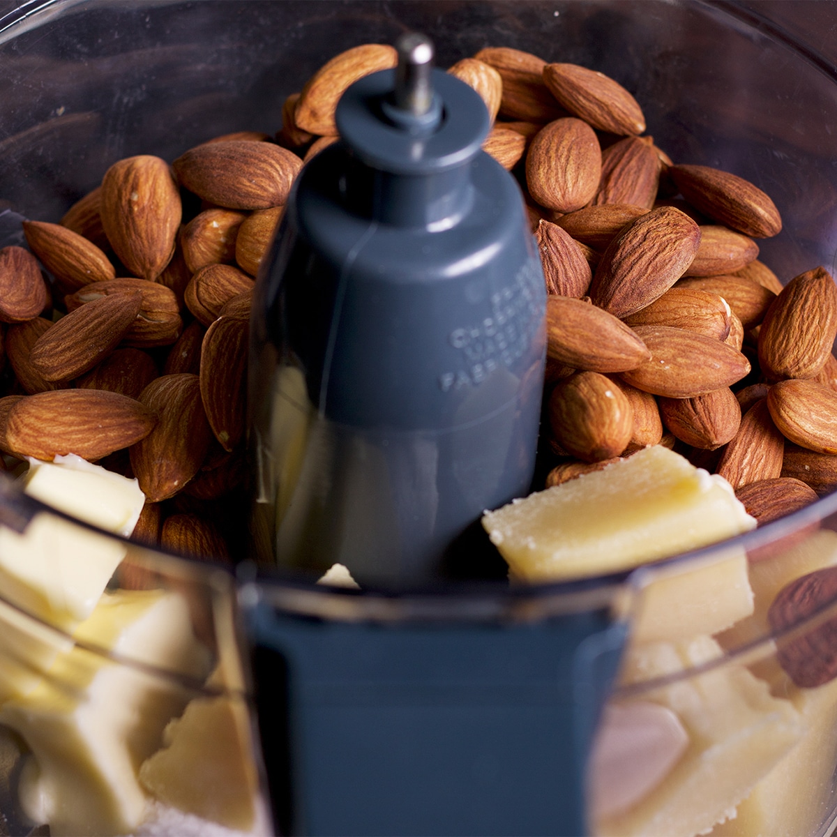 The bowl of a food processor that contains freshly made frangipane.