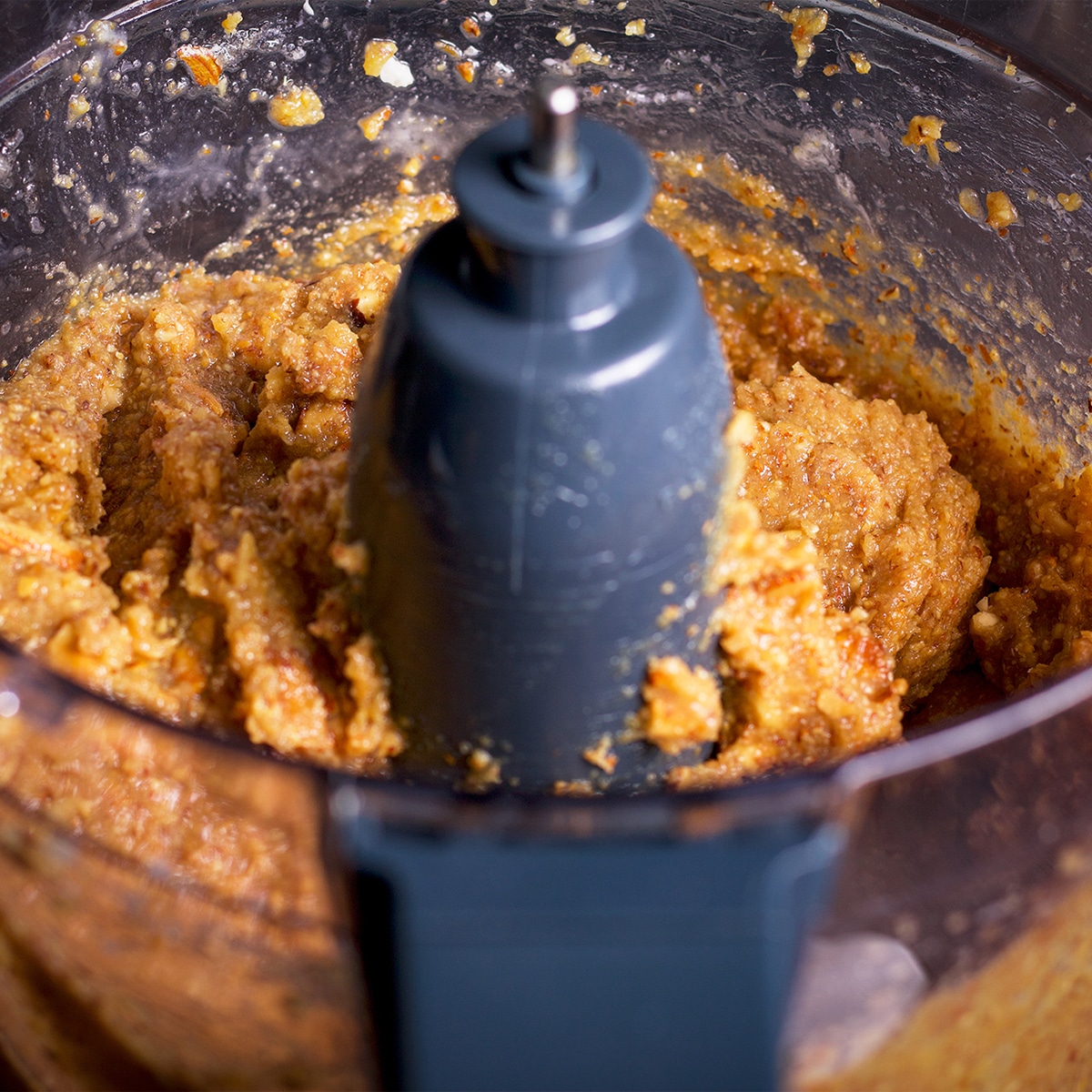 A food processor that contains all the ingredients to make frangipane.