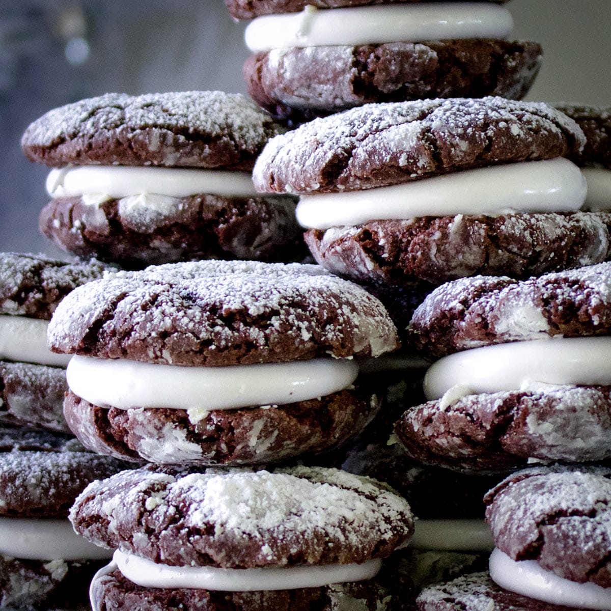 A platter piled high with marshmallow chocolate crinkle cookies.