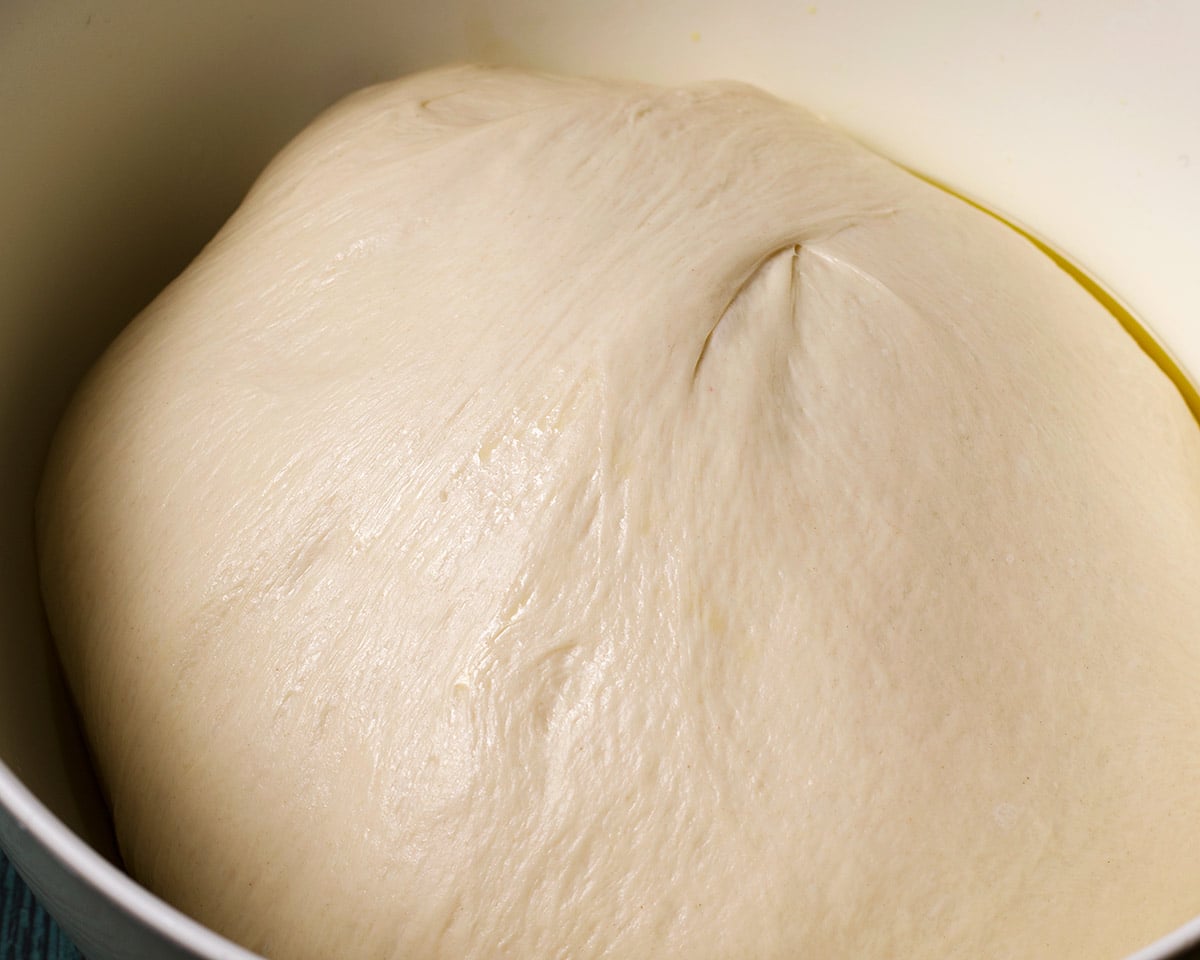Pizza dough that has doubled in size and is ready to use.