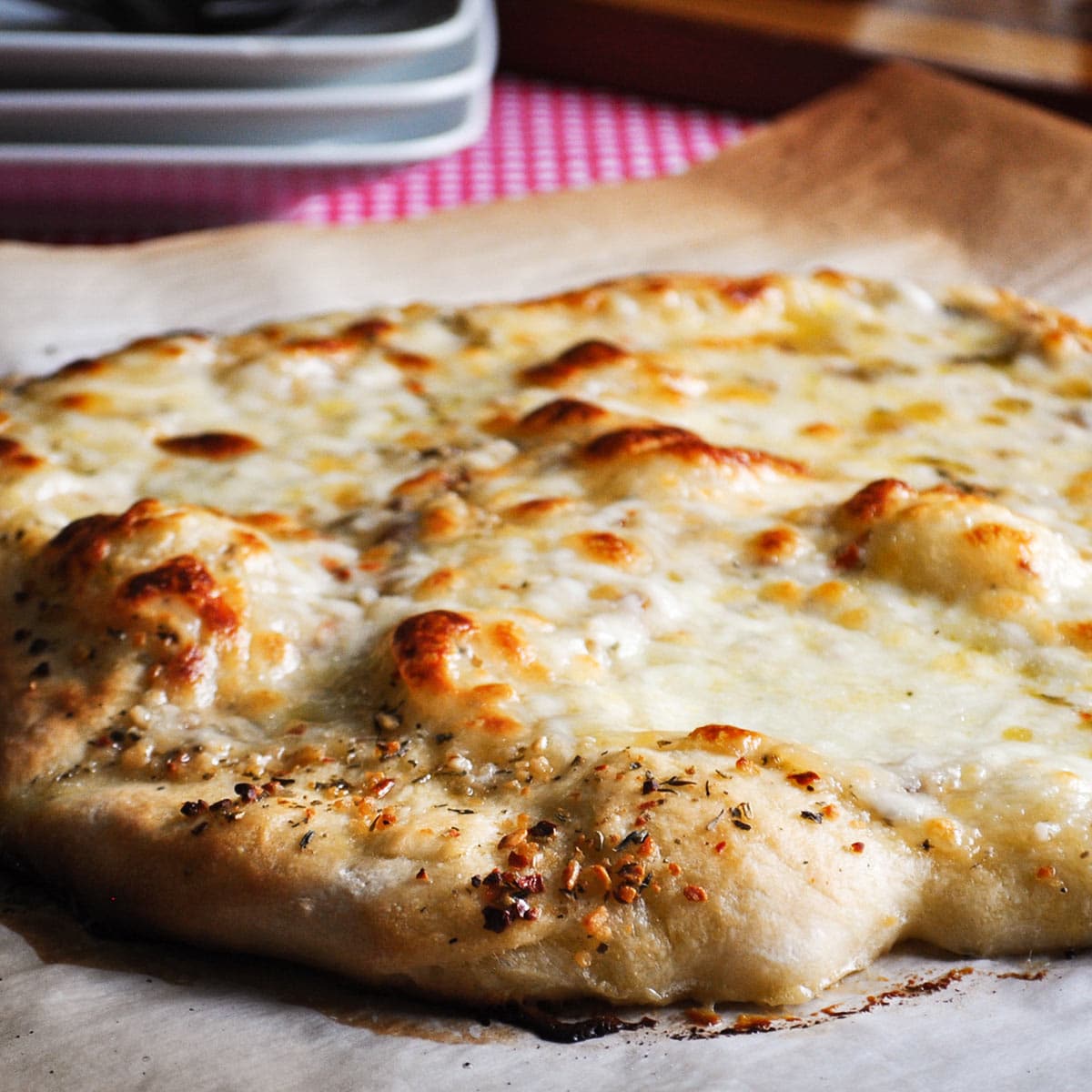 A just baked homemade cheese pizza.
