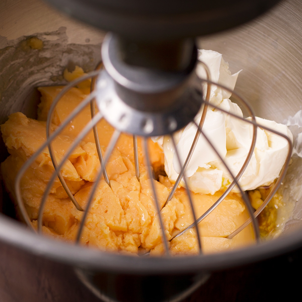 Beating mascarpone cheese into pastry cream.