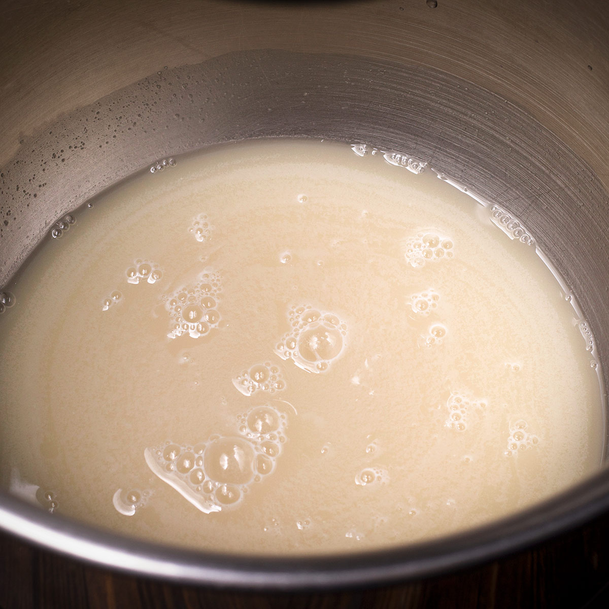 Yeast in a bowl of warm water that's just started to bubble and make the water creamy.