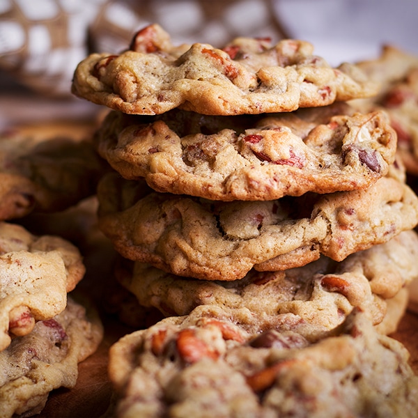 A stack of Anything Cookies on a tray with other cookies all around.