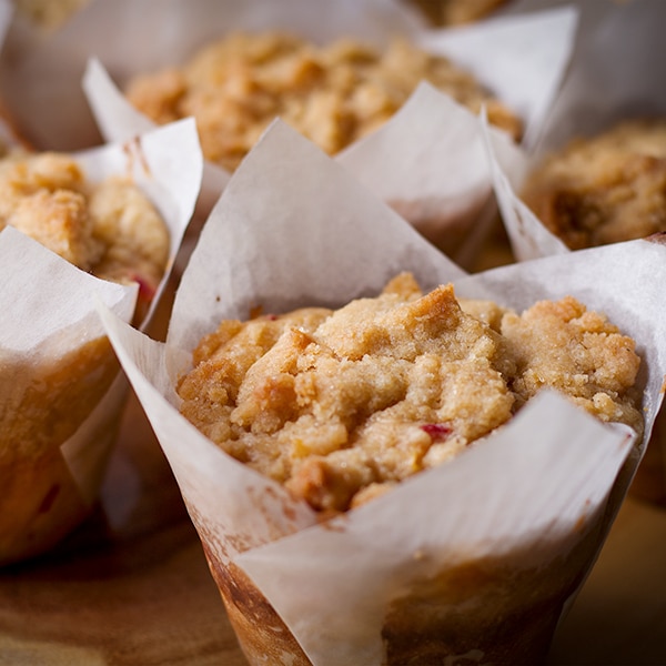 Peach Cobbler Muffins on a tray, fresh from the oven.