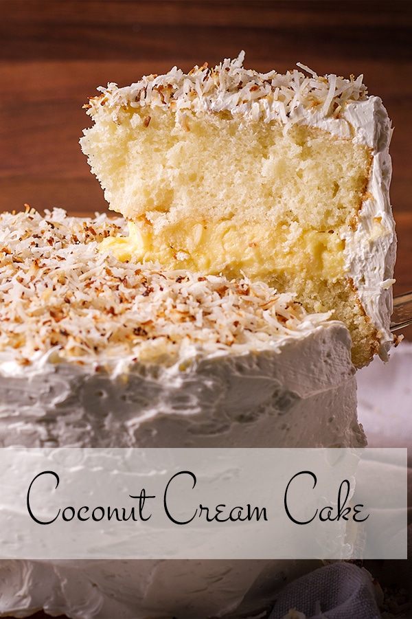 Serving a slice of coconut cream cake frosted with coconut buttercream.