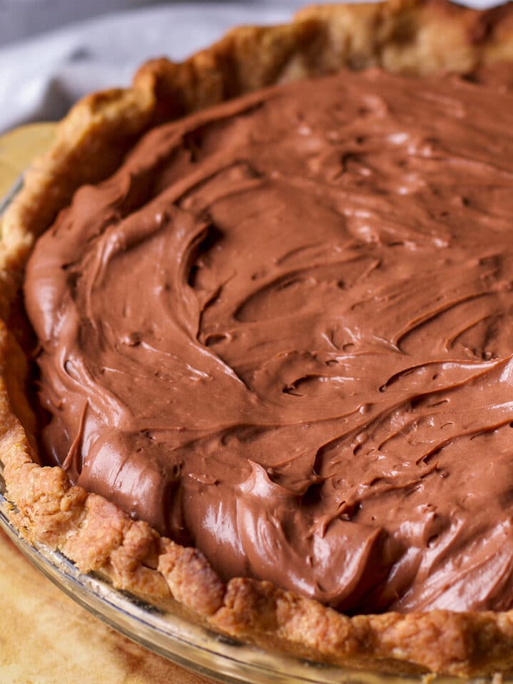 A baked toasted almond pie crust filled with chocolate pastry cream.