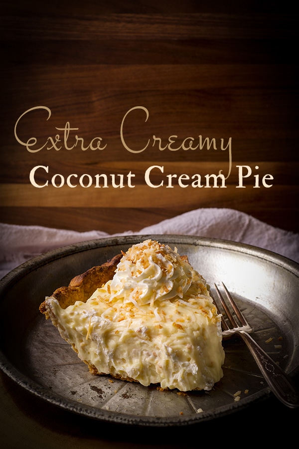 A slice of coconut cream pie on a plate.