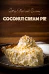 A thick slice of coconut cream pie on a tin plate.
