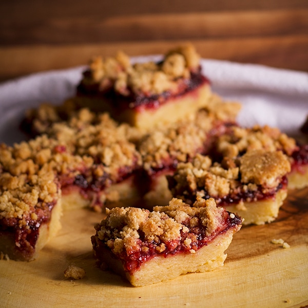 A tray of cherry shortbread crumble bars.