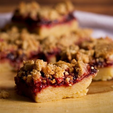 A tray of cherry shortbread crumble bars.