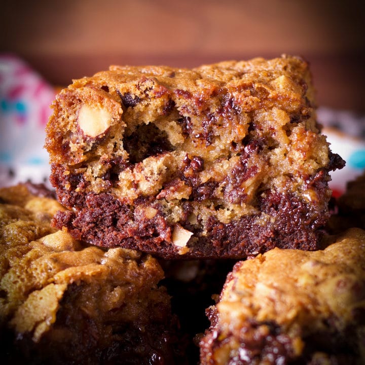 A tray of gooey chocolate chip cookie brownie bars.