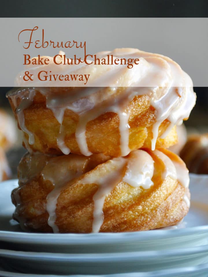 Two French Cruller Doughnuts sitting on a plate. French Crullers are the February 2021 Bake Club Challenge Recipe.