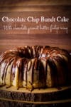 A chocolate chip Bundt Cake covered in chocolate peanut butter fudge icing on a wood serving platter.
