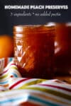 A jar of homemade peach preserves on a table covered with a colorful striped tablecloth.