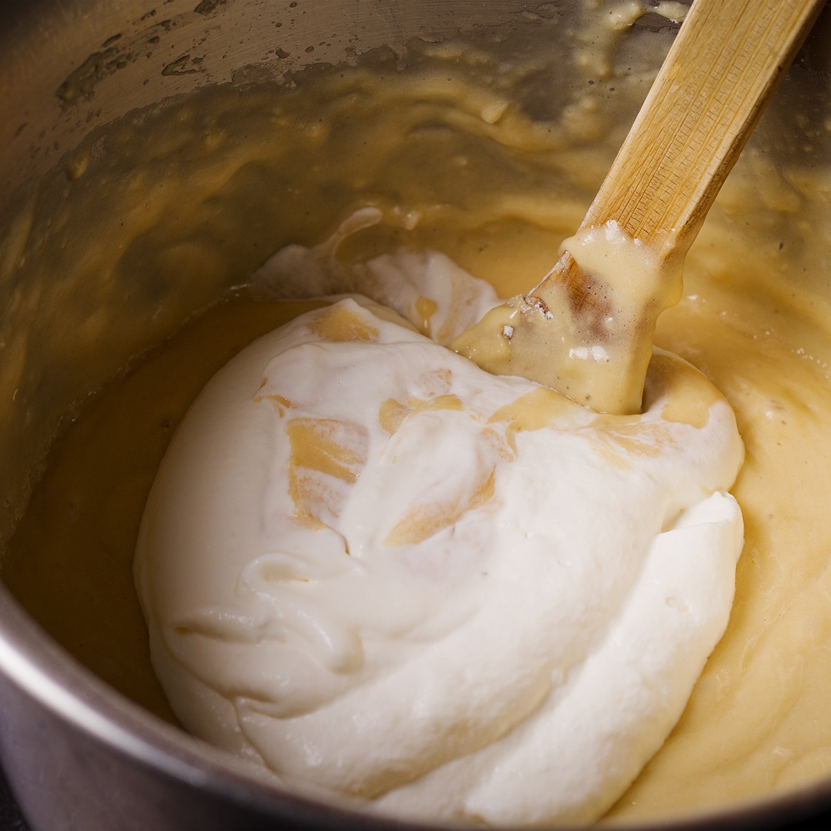 Gently fold whipped cream into the loaf cake batter.