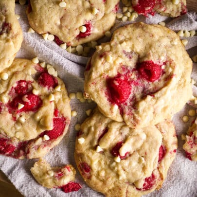A tray filled with white chocolate raspberry cookies.